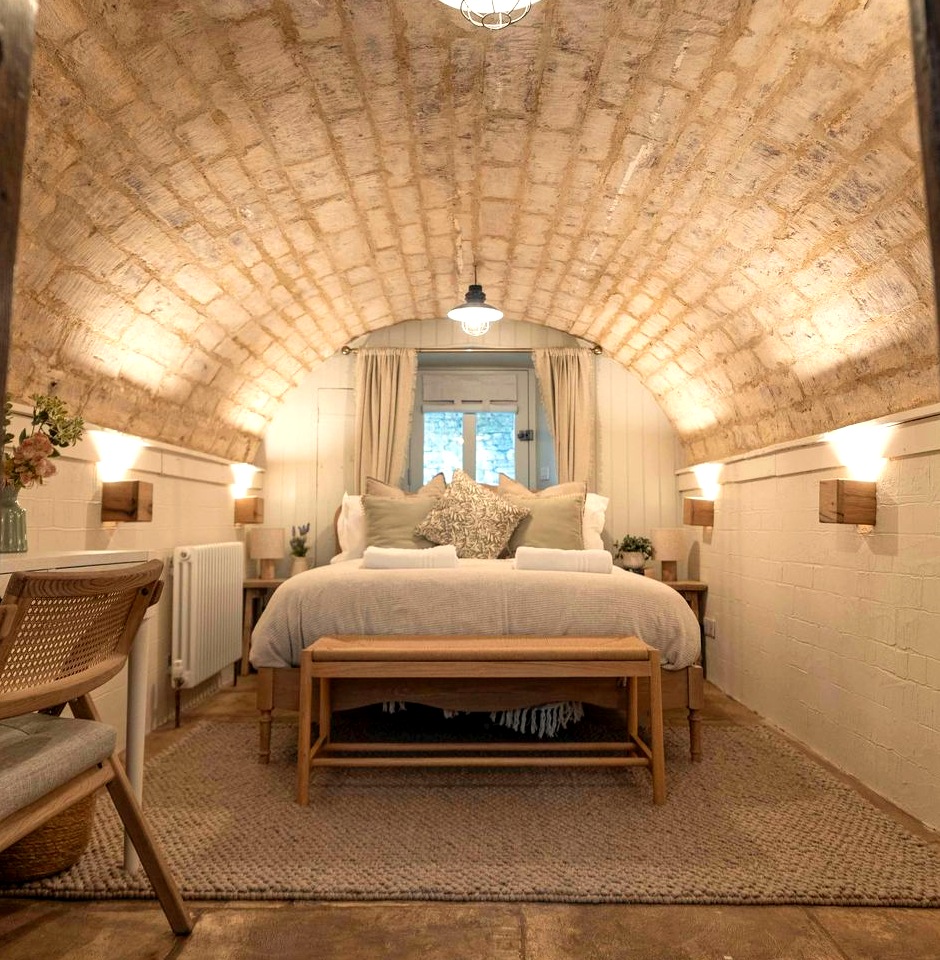Bedroom in a cellar under a vaulted stone ceiling